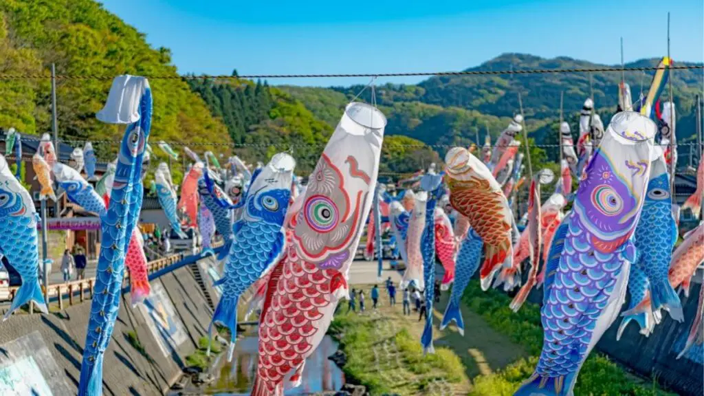 What is the meaning and origin of the carp streamer swimming in the sky?